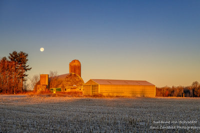 Setting full moon and barn