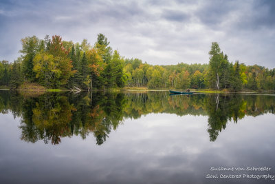 Early fall colors atAudie Lake with canoe