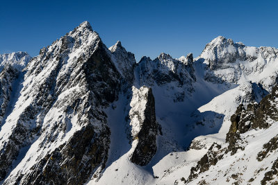 Prostredny Hrot 2441m and Siroka Veza 2461m on the right seen from Lomnicky Peak 2634m ascent, High Tatras