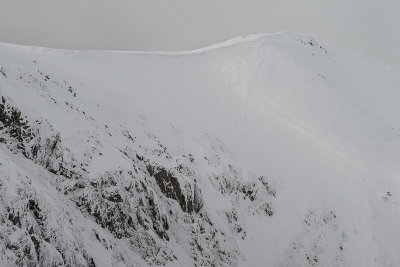 Ciemniak 2096m ridge with hikers seen from Krzesanica 2122m descent, West Tatras