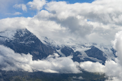 Closeup on Eiger 3970m, further away to the right in clouds Mönch 4110m and Jungfrau massif  4158m