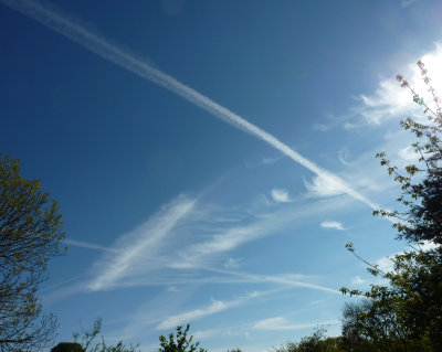 Con trails and clouds