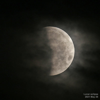 Eclipsed moon in clouds