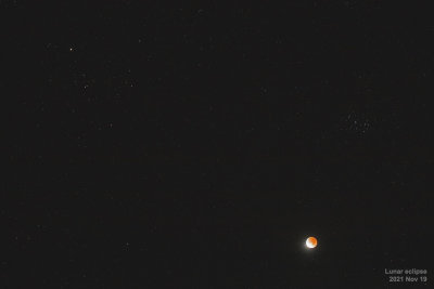 Eclipsed moon widefield with star clusters