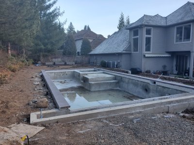Brick coping, tile and water fountains installed
