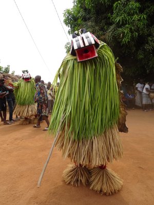 A mask dancer posing for us