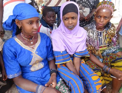Three young girls at a market