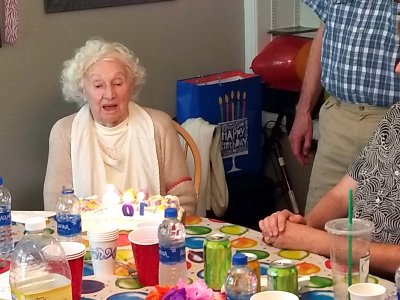 19 Naoma about to blow out 102 candles.jpg