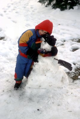 03 Dylan removing head of small snow person.jpg