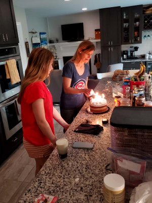 07 Bailey and Erica setting the cake on fire.jpg