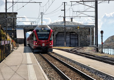 RhB train arriving at Ospizio Bernina