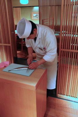 THE SUSHI MASTER SHOWS HIS FISH CARVING SKILLS