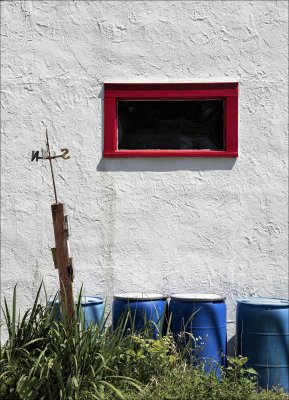 Red Window, White Wall & Blue Barrels