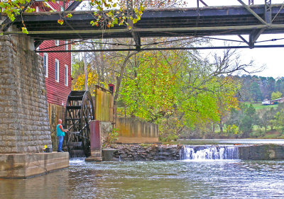 Fisherman under bridge 