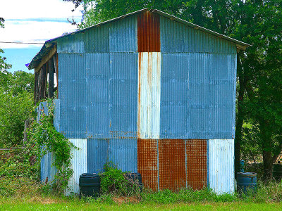 Barn with redish rust, white and blue.  Abstract patriotism?