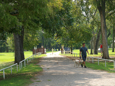 Walking a dog on hiking trail at Fisherman's Park 