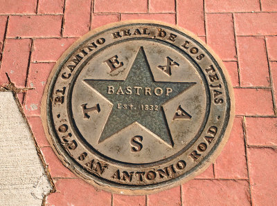 Bastrop, Medallion in sidewalk on Chestnut St. #3