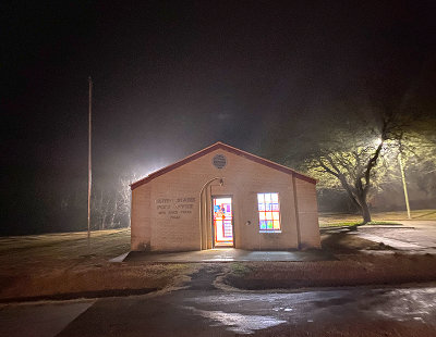 Red Rock, Texas Post Office on a foggy, misty night.