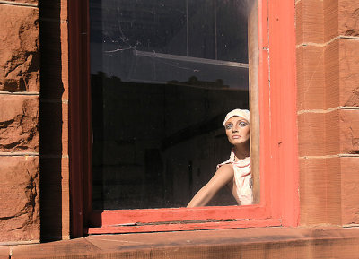 Mannequin in old bank window, Taylor, Texas