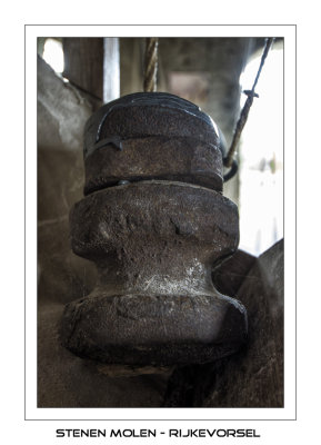 Old metal parts used as a weight to control the millsones