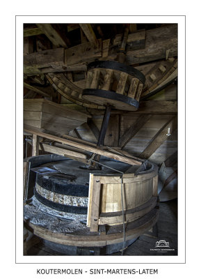 Millstones with partially removed wooden casing