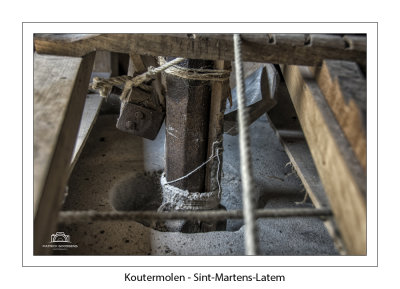 The iron shaft going into the runner millstone