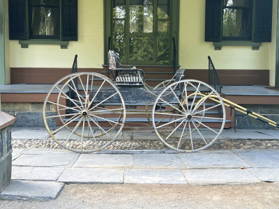 An old-fashioned carriage was at the front entrance. 