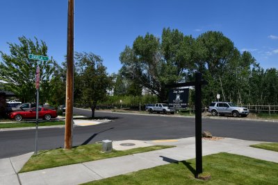 standing in the front yard looking at nursery
