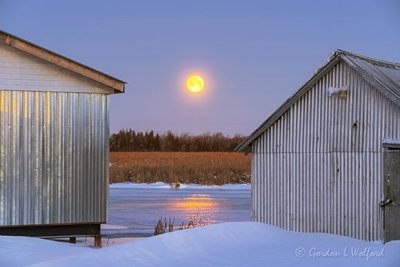 Snow Moon Setting Between Boathouses P1510513-9
