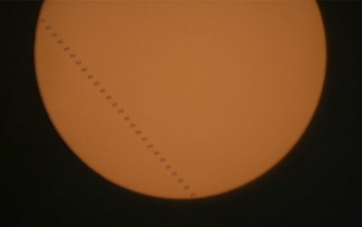 The International Space Station transits the Sun