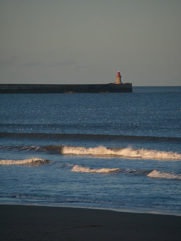 Tynemouth south pier lit up by the days last sunrays