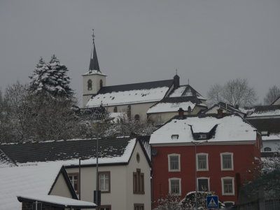 Village church with red house