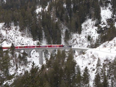 Passenger train passing the Schmittentobel Viadukt