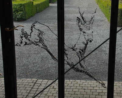 Glass portal giving access to the gardens of the castle