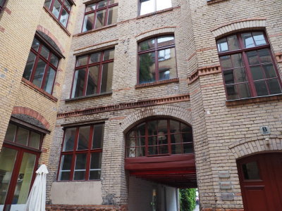 Gipshöfe with damage from WW II grenades and caretaker's lodging above the passage-way