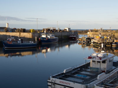 Sun setting over Seahouses harbour
