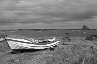 Lindisfarne Castle with boats BW
