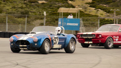 Two of Carroll Shelby's finest exiting turn 11 at Laguna Seca.