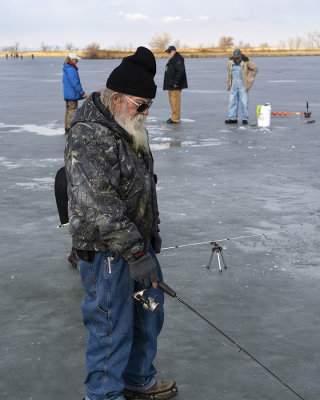 A Gentleman of 77 years young, ice fishing on the Bountiful Pond