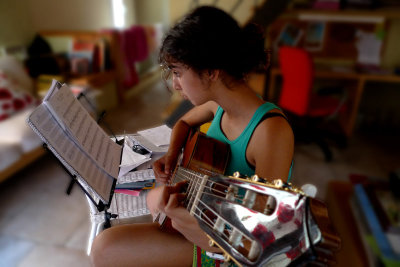 Dedicated in playing guitar