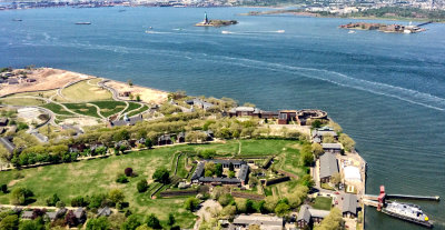 This view of New York harbor shows Governors Island with Fort Jay and Castle Williams, The Statue of Liberty, and Ellis Island