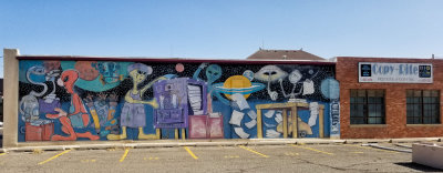 Printing and Copying company with their alien mural in the parking lot