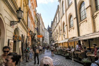 Restaurants on cobblestone street in Prague