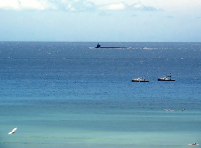 Navy submarine passing Waikiki