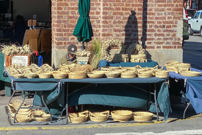Sweetgrass Basket Maker Displaying Her Wares in the City Market