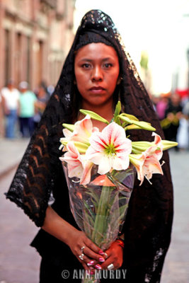 Holding lilies in procession