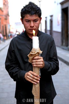 Holding candle