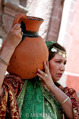 Carrying jug in procession