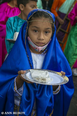 Little girl in the procession of Cristos