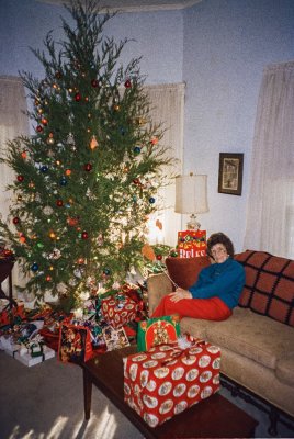 Lura Holleman with Christmas tree & flyswatter, Chickasaw Co., Miss.